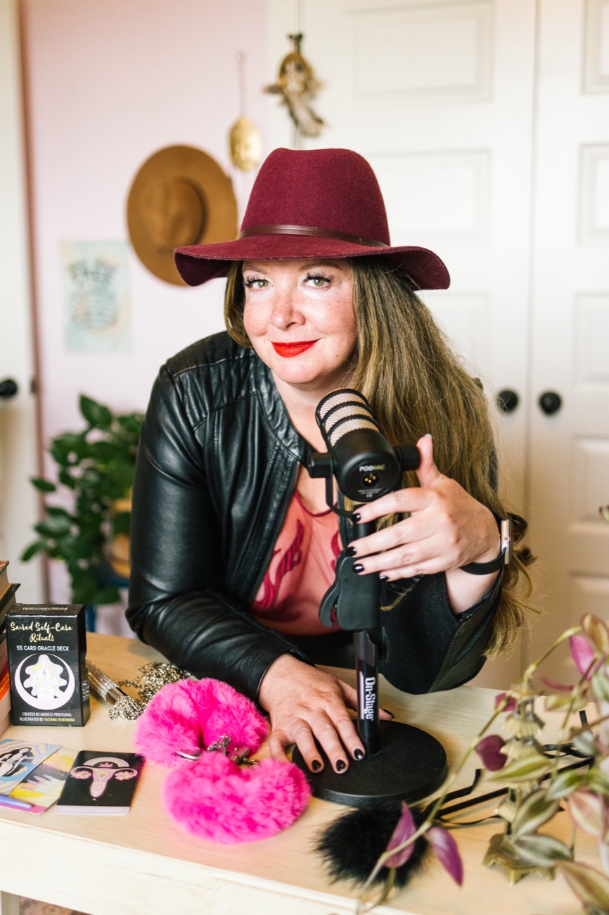 Jennifer at her podcast microphone
